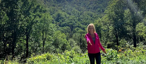 Cindy Baumann smiling warmly, ready to connect and help with your questions